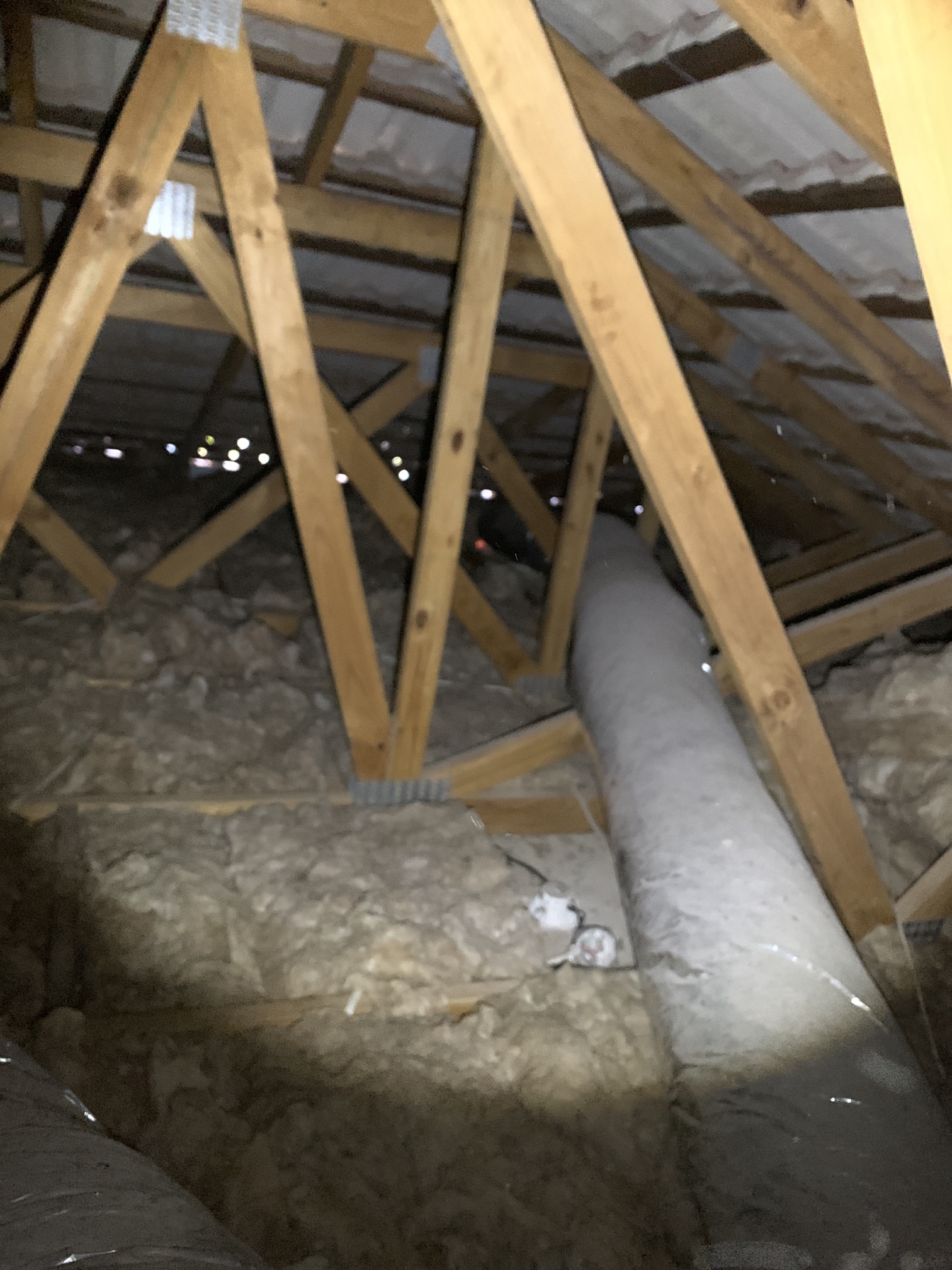 Ducted air conditioning cleaning Gold Coast roof space inspection showing insulated ductwork inside ceiling cavity