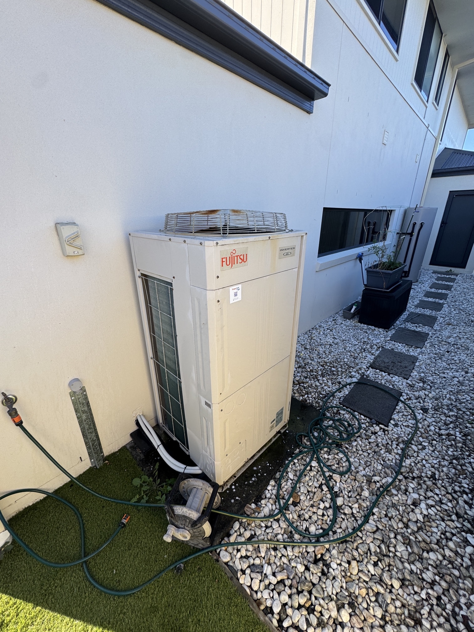 TemperCool technician assessing a Fujitsu air conditioner repair on the Gold Coast