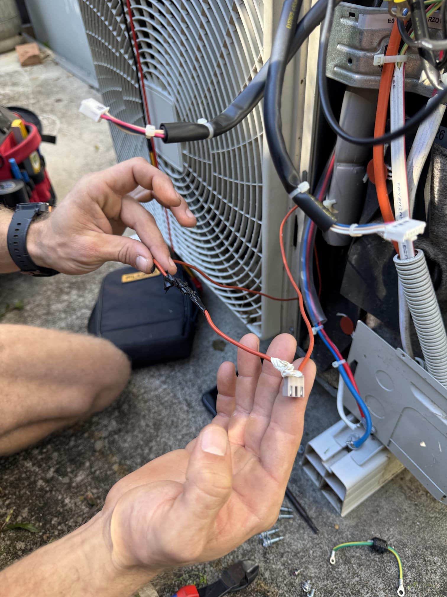 Taped electronic components found during a Daikin U4 fault inspection in Helensvale