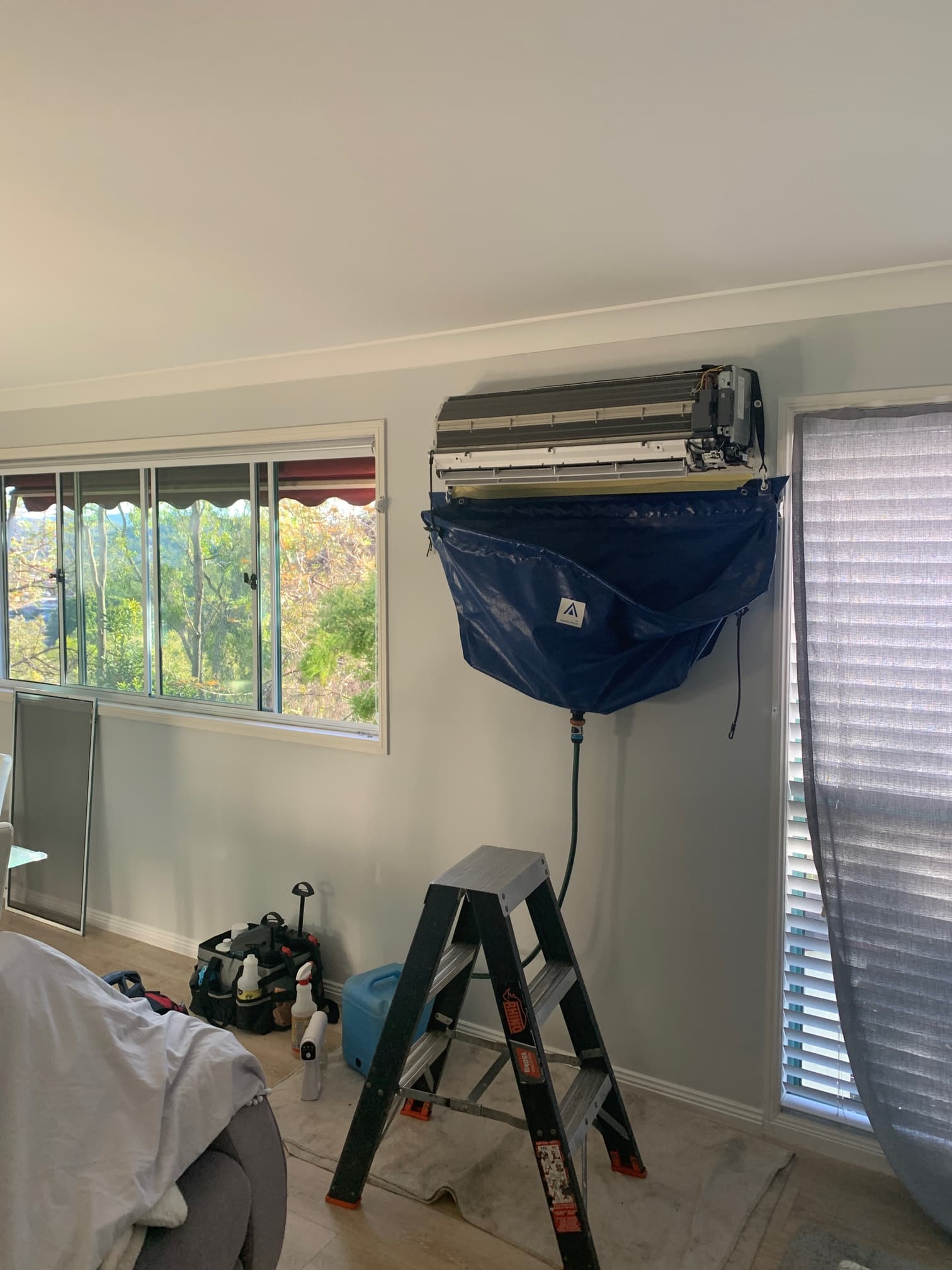 Air conditioning cleaning being completed by TemperCool technician