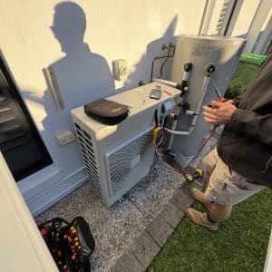 Daikin air conditioning service Gold Coast specialist checking outdoor Daikin aircon unit